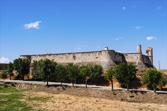 The Medieval Castle of Chinchon in Madrid. Sunny day of summer with blue sky