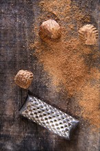 Detail of the grating of nutmeg flavor unique to particular foods and flavors