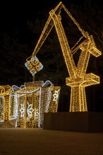 Construction crane symbol of Shipyard Holiday illuminated decorations in Gdansk Poland. Beautiful