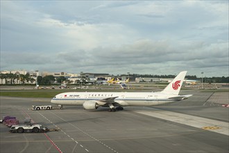 19.12.2019, Singapore, Republic of Singapore, Asia, An Air China Boeing 787 Dreamliner passenger