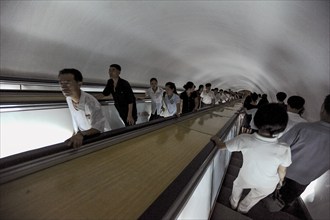 09.08.2012, Pyongyang, North Korea, Asia, Commuters on an escalator leading to an underground