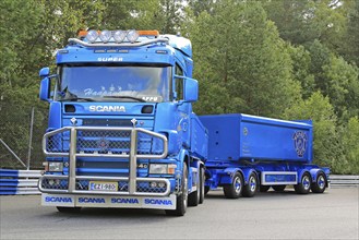 HAMEENLINNA, FINLAND, JULY 16, 2016: Blue Scania 164G V8 truck and gravel trailers for construction