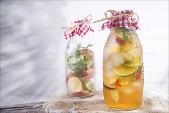 Bottle of infused fruit tea with peach and lemon