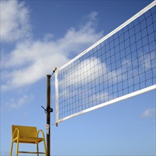 Sport Image Of A Volleyball Net On A Beach With A Referees Chair