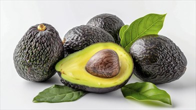 Dark shaded avocados, one sliced open with a seed, accompanied by rich green leaves, AI generated