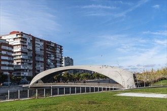 Madrid, Spain, December 9, 2019: Modern concrete bridge over Manzanares River in Madrid RIo area,