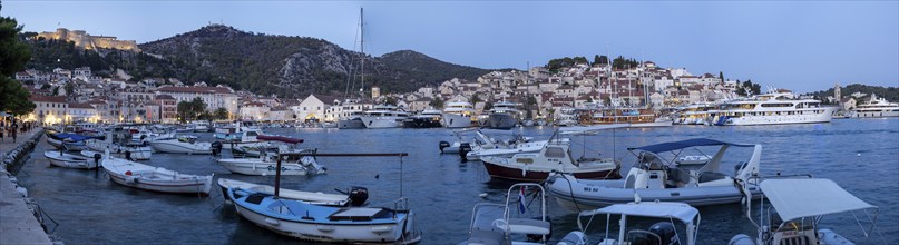 Boats in the harbour, blue hour, panoramic shot, town of Hvar, island of Hvar, Dalmatia, Croatia,