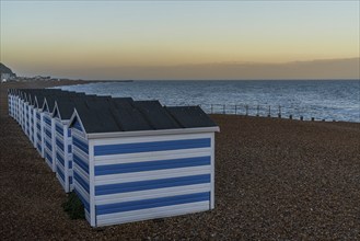 Hastings, East Sussex, England, UK, May 11, 2022: Evening mood on the beach with some beach huts