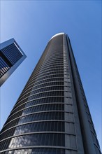 Madrid, Spain, February 7, 2021: Low angle view of skyscrapers in Cuatro Torres financial district.