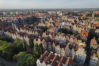 Beautiful panoramic architecture of old town in Gdansk, Poland at sunrise. Aerial view drone pov.