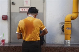 01/02/2019, Singapore, Republic of Singapore, Asia, Rear view of a man with a sweaty T-shirt