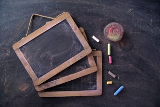 Presentation of small antique school blackboards of the past with chalk and selvedge