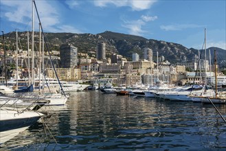 Awe Morning view on boats and yachts (sailboats) in Hercule port and buildings of Monaco and Monte