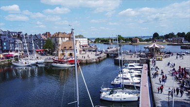 Aerial view of the yachts and bridge in old harbor in Honfleur, a resort and ancient town in