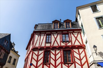 Low angle view of colorful timber-framed medieval house in historic centre of Vannes, Brittany,