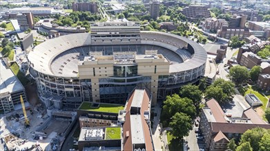 An aerial view of Neyland Stadium reveals a massive, iconic structure nestled by the Tennessee