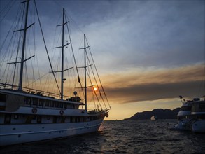 Evening atmosphere in front of sunset, sailing yacht, harbour of Korcula, island of Korcula,