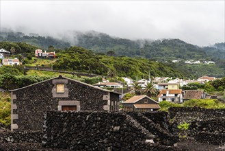 Small village. Traditional rural landscape in Terceira Island a cloudy day of summer. Houses a