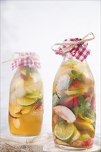 Bottle of infused fruit tea with peach and lemon