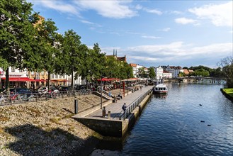 Lubeck, Germany, August 3, 2019: Scenic view of Trave River and waterfront in the old harbour,