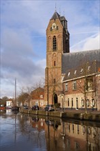 St. Michael church along the river Hollandsche IJssel in the historical town Oudewater in the Dutch