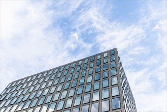 Low angle view of office Buildings in Downtown District against blue sky. Technology and Financial