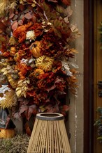 Fall cozy pumpkins in autumn outside. Thanksgiving or Halloween holiday decoration. House entrance