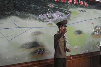 10.08.2012, Panmunjom, North Korea, Asia, A North Korean soldier explains details of the border