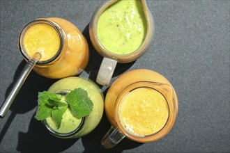 Seasonal Matcha green vegan smoothie with chia seeds and mint pumpkin carrot smoothie drink detox