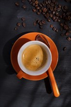 Presentation of a cup of coffee on a black background