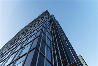 Amsterdam, Netherlands, May 7, 2022: Skyscraper against sky. Contemporary architecture, blue colors