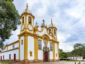 Baroque church facade with its towers in downtown of the historic city of Tiradentes in Minas