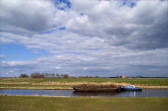 Boat on the river Linde near Kuinre in the Dutch province Overijssel