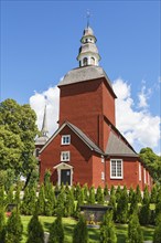 Rural red Wooden Church in summer