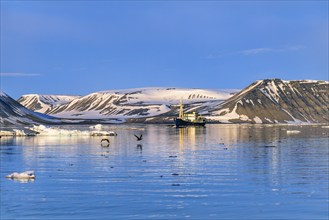 Ship in a bay at the coast in Spitsbergen