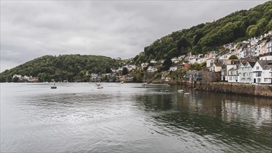 Dartmouth, Devon, England, UK, May 26, 2022: The bank of the River Dart with some boats and the