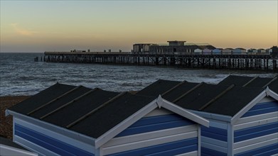 Hastings, East Sussex, England, UK, May 11, 2022: Evening mood on the beach, with some beach huts