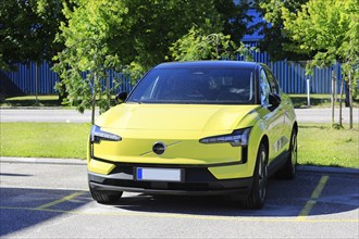 2024 Yellow Volvo EX30, a battery electric subcompact crossover SUV manufactured by Volvo Cars,