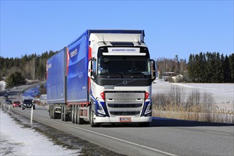 New Volvo FH truck Koskinen Yhtiot pulls freight trailer along highway 52 on a day of spring. Salo,