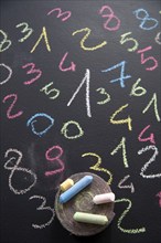 Graphic representation with chalk on blackboard with colorful numbers