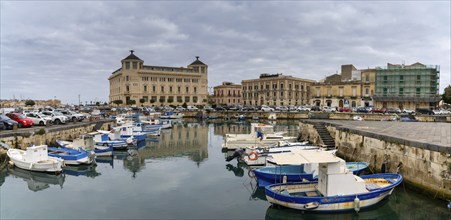 Syracuse, Italy, 28 December, 2023: colourful boats in the harbour between Syracuse and Ortygia