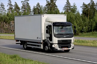 PAIMIO, FINLAND, JUNE 3, 2016: White Volvo FE delivery truck transports goods along motorway at