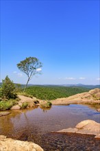 River with calm waters among the rocks, mountains and vegetation of the Muaimii environmental