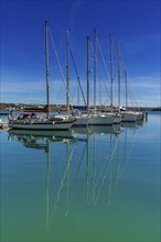 Mahon, Spain, 24 January, 2024: vertical view of moored sailboats in the harbour of Mahon on