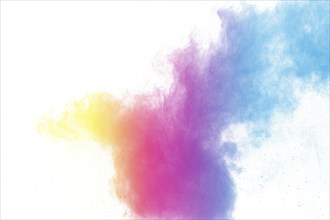 Abstract color powder explosion on white background.Freeze motion of dust splash. Painted Holi in