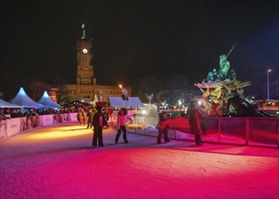 12-23-2023 BERLIN Ice rink on central Christmas market of Berlin and night color illumination