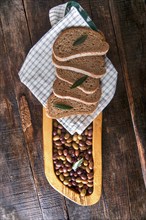 Aperitif made of bread with mixed olives in brine of Tuscany Italy