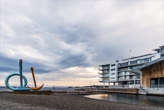 Oslo, Norway, August 11, 2019: Scenic view of sunset on Tjuvholmen quarter a new modern urban