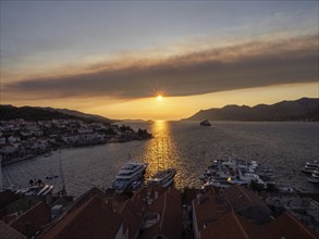 Evening atmosphere in front of sunset, view from the bell tower, Korcula harbour, Korcula island,