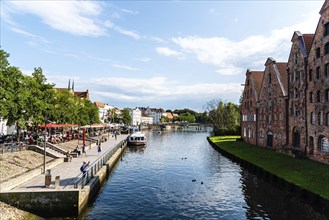 Lubeck, Germany, August 3, 2019: Scenic view of Trave River and Salzspeicher buildings, Europe